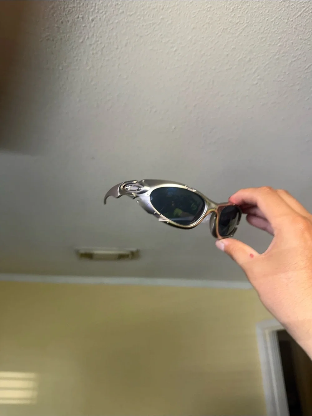 Futuristic Silver Sunglasses with Dark Lenses Oakley